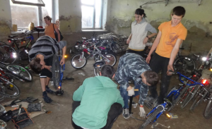 Volunteers put pedals back onto the bikes in Moldova.