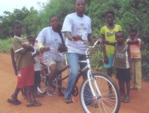 Adu and Yaa on their tandem bicycle