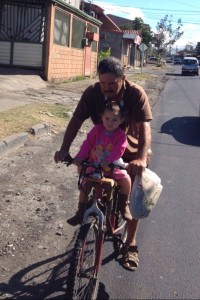 Javier and daughter on their daily ride