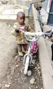 Mrs. Johari's son with bike