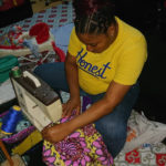 Cameroon woman sewing