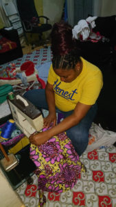 Cameroon woman sewing