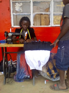 Ugana graduate in her workshop