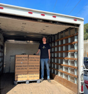 Alan with 30 sewing machines bound for Sierra Leone, October 5th, 2023