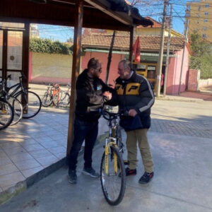 Man getting a bike in Albania
