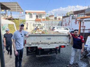 Alan and Pedro with truck of bikes